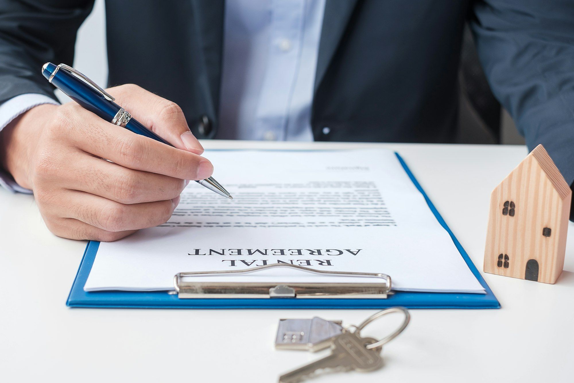 man signing home contract documents. Contract agreement, real estate, buy and sale and insurance
